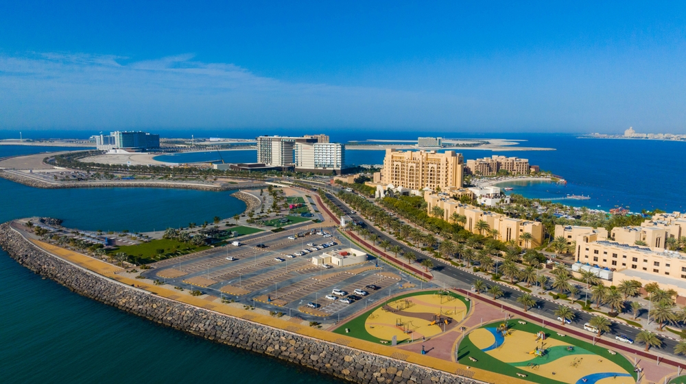 Al Marjan Island aerial masterplan view showing 4-island development spanning 2.7 million square meters with resorts, residences, parks and beaches in Ras Al Khaimah UAE
